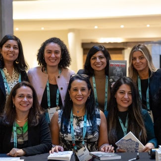 Women at a book signing at WLS 2025